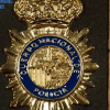 Placa de policía falsa que presentó el detenido